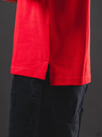 Polo OTTO Basic rojo/blanco – detalle de abertura lateral en el ruedo